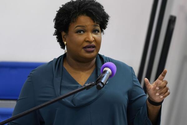 FILE - Stacey Abrams speaks during a church service in Norfolk, Va., Sunday, Oct. 17, 2021. A political organization led by the Democratic titan is branching out into paying off medical debts. Fair Fight Action on Wednesday, Oct. 27 told The Associated Press that it is donating $1.34 million from its political action committee to wipe out debt owed by 108,000 people in Georgia, Arizona, Louisiana, Mississippi and Alabama.   (AP Photo/Steve Helber, File)