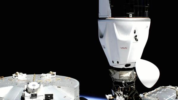 In this image provided by SpaceX, the Crew Dragon capsule is docked at the International Space Station, Wednesday, April 27, 2022. four astronauts arrived at the space station Wednesday night, just 16 hours after a predawn liftoff from Kennedy Space Center that thrilled spectators. (SpaceX via AP)