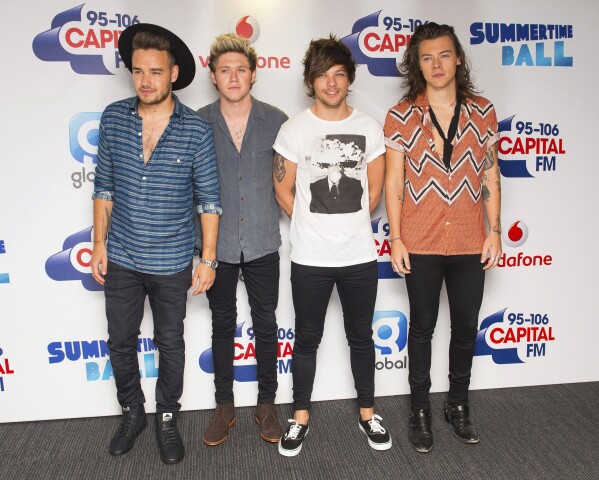 FILE - One Direction's Liam Payne, from left, Niall Horan, Louis Tomlinson and Harry Styles pose backstage at the Capital FM Summertime Ball held at Wembley Stadium, in London, on June 6, 2015. (Dominic Lipinski/PA via AP, File)