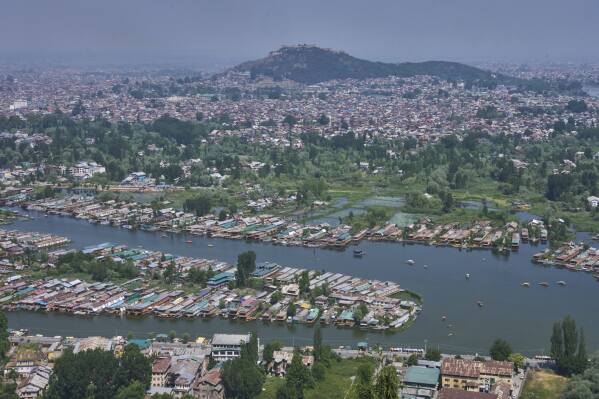 Rows of empty houseboats in Dal lake, one of the major tourist destination seen from a mountain in Srinagar, Indian controlled Kashmir, India, Tuesday, May 20, 2025. (AP Photo/Dar Yasin)