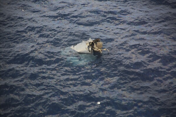 In this photo provided by Japan Coast Guard, debris believed to be from a U.S. military Osprey aircraft is seen off the coast of Yakushima Island in Kagoshima Prefecture in Japan Wednesday, Nov. 29, 2023. A crew member who was recovered from the ocean after a U.S. military Osprey aircraft carrying six people crashed Wednesday off southern Japan has been pronounced dead, coast guard officials said. (Japan Coast Guard via AP)