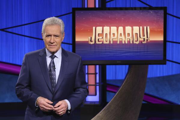 FILE - This image released by Jeopardy! shows Alex Trebek, host of the game show "Jeopardy!"  Filling the void left by Trebek after 37 years involves sophisticated research and a parade of guest hosts doing their best to impress viewers and the studio that will make the call.  (Jeopardy! via AP)