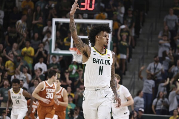 Baylor forward Jalen Bridges reacts to his three-point play against Texas in the first half of an NCAA college basketball game, Monday, March 4, 2024, in Waco, Texas. (Rod Aydelotte/Waco Tribune-Herald via AP)