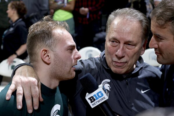 Michigan State coach Tom Izzo, center, and his son, Steven Izzo, left, are interviewed by the Big Ten Network's Andy Katz following an NCAA college basketball game, Wednesday, March 6, 2024, in East Lansing, Mich. (AP Photo/Al Goldis)
