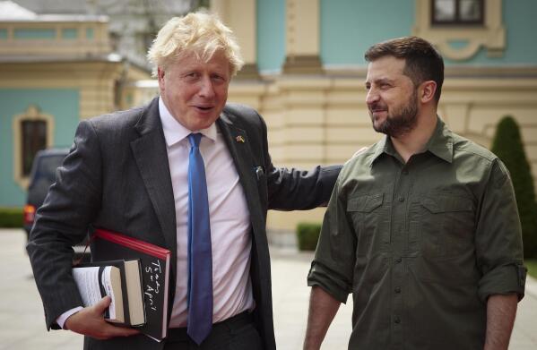 In this image provided by the Ukrainian Presidential Press Office, Ukrainian President Volodymyr Zelenskyy, right, and Britain's Prime Minister Boris Johnson, ahead of their meeting in Kyiv, Ukraine, Friday, June 17, 2022. (Ukrainian Presidential Press Office via AP)