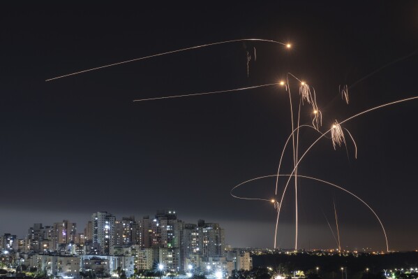 Israel's Iron Dome missile defense system fires interceptors at rockets launched from the Gaza Strip, as seen from Ashkelon, Israel, on May 11, 2023. (AP Photo/Tsafrir Abayov)