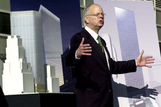 Architect David Childs talks about his design for the new 7 World Trade Center, a 52-story building which will rise to a height of 750 feet, during the design's unveiling at the building's construction site in New York, Wednesday, Nov. 20, 2002. (AP Photo/Ed Bailey, file)