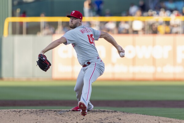 Philadelphia Phillies pitcher Zack Wheeler throws to the Athletics during the second inning of a baseball game Friday, May 23, 2025, in West Sacramento, Calif. (AP Photo/Sara Nevis)