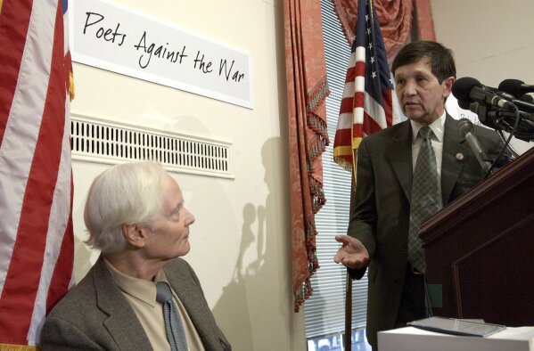 
              FILE -- In this March 5, 2003 file photo, U.S. Rep. Dennis Kucinich, D-Ohio, right, gestures toward Pulitzer Prize winning poet W.S. Merwin during a Capitol Hill news conference. Merwin, a prolific and versatile master of modern poetry who evolved through a wide range of styles as he celebrated nature, condemned war and industrialism and reached for the elusive past, died on Friday, March 15, 2019 at his home in Hawaii. A Pulitzer Prize winner and former U.S. poet laureate, Merwin completed more than 20 books and ranked high in the pantheon for decades, from early works inspired by myths and legends to late meditations on age and time. (AP Photo/Evan Vucci, File)
            