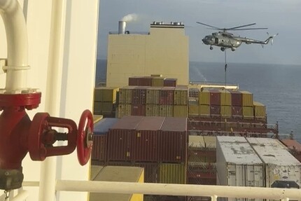 This image made from a video provided to The Associated Press by a Mideast defense official shows a helicopter raid targeting a vessel near the Strait of Hormuz on Saturday, April 13, 2024. A video seen by The Associated Press shows commandos raiding a ship near the Strait of Hormuz by helicopter Saturday, an attack a Mideast defense official attributed to Iran amid wider tensions between Tehran and the West. The Mideast defense official spoke on condition of anonymity to discuss intelligence matters. (AP Photo)
