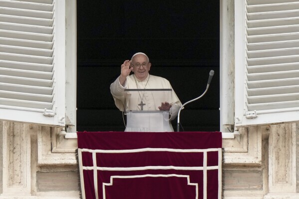 Pope Francis delivers his blessing as he recites the Angelus noon prayer from the window of his studio overlooking St.Peter's Square, at the Vatican, on the occasion of All Saints day, Wednesday, Nov. 1, 2023. (AP Photo/Andrew Medichini)