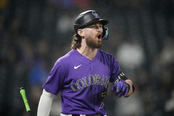 Joe, Grichuk lead Rockies over Cubs 4-3 for rare road win