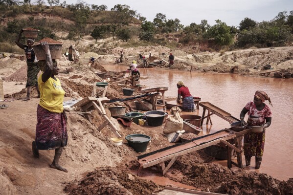 Women process gold at a mining site in the Kedougou region of Senegal on Thursday, Jan. 16, 2025. (AP Photo/Annika Hammerschlag)