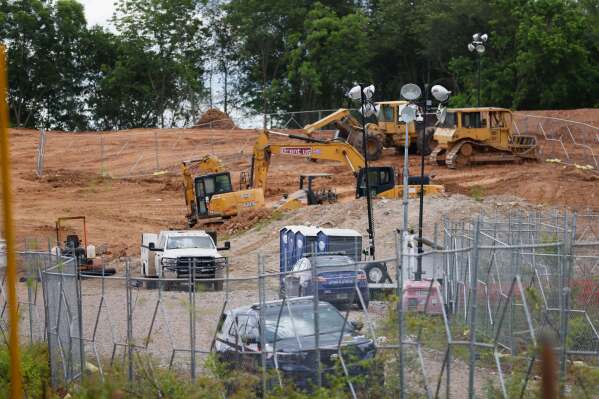 Bulldozers and heavy trucks are clearing the future site of the Atlanta Public Safety Training Center, May 30, 2023, in Atlanta. (Miguel Martinez/Atlanta Journal-Constitution via AP, File)