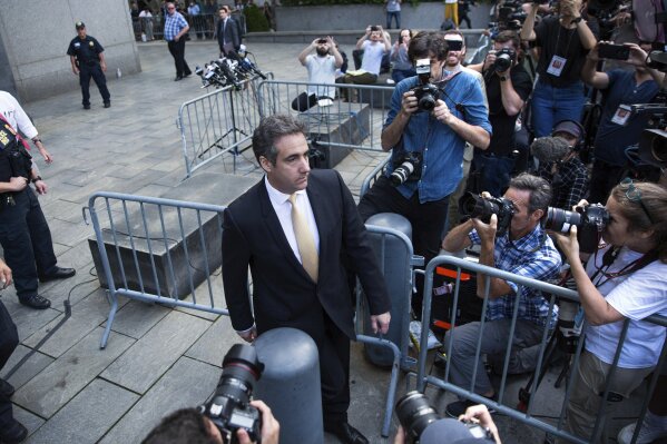 
              Michael Cohen, former lawyer to President Donald Trump, departs following his appearance in Federal Court on Tuesday, Aug. 21, 2018, in New York. Cohen, has pleaded guilty to charges including campaign finance fraud stemming from hush money payments to porn actress Stormy Daniels and ex-Playboy model Karen McDougal. (AP Photo/Kevin Hagen)
            