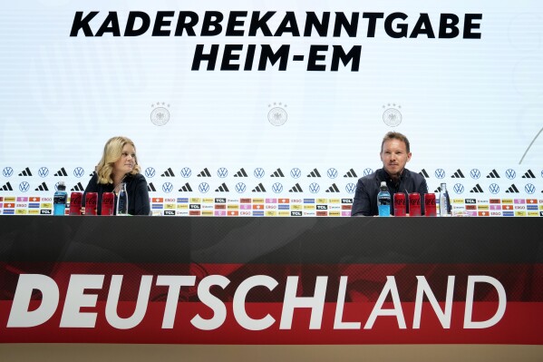 German's head coach Julian Nagelsmann, right, speaks to the media at the presenting of the German national soccer team for the upcoming European Championships in Berlin, Germany, Thursday, May, 16, 2024. The UEFA Euro 2024 in Germany starts on June 14, the final will be played in Berlin on July 14. (AP Photo/Ebrahim Noroozi)