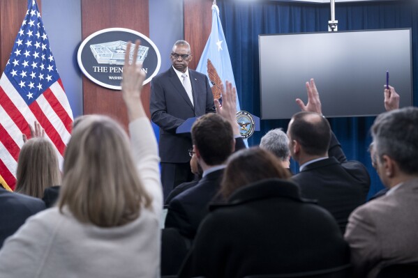 Defense Secretary Lloyd Austin takes question from reporter during a Pentagon press briefing at the Pentagon on Thursday, Feb. 1, 2024 in Washington. (APPhoto/Kevin Wolf)