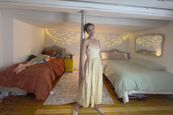 FILE - Erin Eloise Tulberg poses at home in the Brooklyn borough of New York on May 29, 2024, with her 9-year-old son. Tulberg set up a divorce registry after leaving her marriage with little more than her clothes and her books. (Erin Eloise Tulberg via AP)