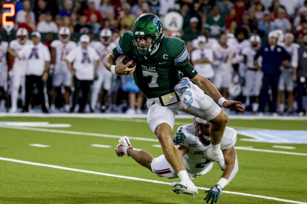 Tulane quarterback Michael Pratt (7) breaks away from South Alabama safety Jaden Voisin (2) during the first quarter of an NCAA college football game in New Orleans, Saturday, Sept. 2, 2023. (AP Photo/Derick Hingle)