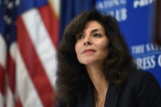 FILE - In this Sept. 21, 2018, file photo, A. Ashley Tabaddor, a federal immigration judge in Los Angeles is introduced to speak at the National Press Club​ in Washington. From 2017 to 2021, she was president of the National Association of Immigration Judges.   The U.S. Justice Department has dropped its opposition to reviving a union for immigration judges that had been stripped of authority during the final months of the Trump administration. The judges' union said in a statement Tuesday, June 29, 2021, that it was optimistic the move would lead to restoration of collecting bargaining rights and reverse what it said was an attempt by the Trump administration to silence judges. (AP Photo/Susan Walsh, File)