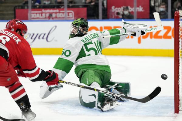 Toronto Maple Leafs goaltender Erik Kallgren (50) makes a save on Carolina Hurricanes center Vincent Trocheck (16) during the third period of an NHL hockey game Thursday, March 17, 2022, in Toronto. (Frank Gunn/The Canadian Press via AP)