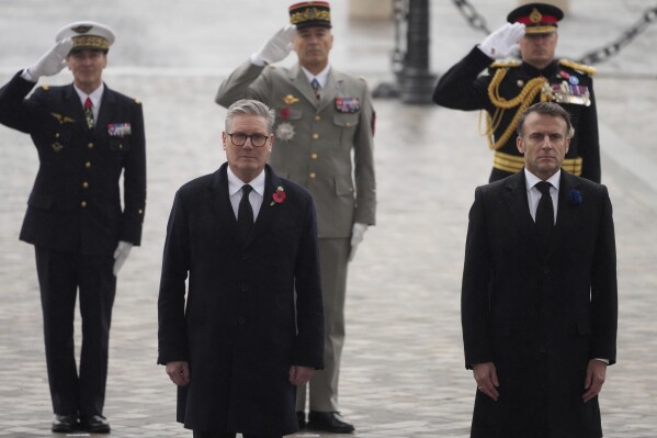French President Emmanuel Macron, right, and British Prime Minister Keir Starmer attend ceremonies marking the 106th anniversary of the Armistice, a celebration of their countries' friendship, as nations across the world pay tribute to their fallen soldiers in World War I, on Nov. 11, 2024 in Paris, (AP Photo/Michel Euler, Pool File)