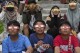 FILE - Youths wear protective glasses to watch a hybrid solar eclipse in Jakarta, Indonesia, Thursday, April 20, 2023. On Saturday, Oct. 14, 2023, an annular solar eclipse _ better known as a ring of fire _ will briefly dim the skies over parts of the western U.S. and Central and South America. Proper protection is needed throughout the eclipse, from the initial partial phase to the ring of fire to the final partial phase. (AP Photo/Tatan Syuflana, File)