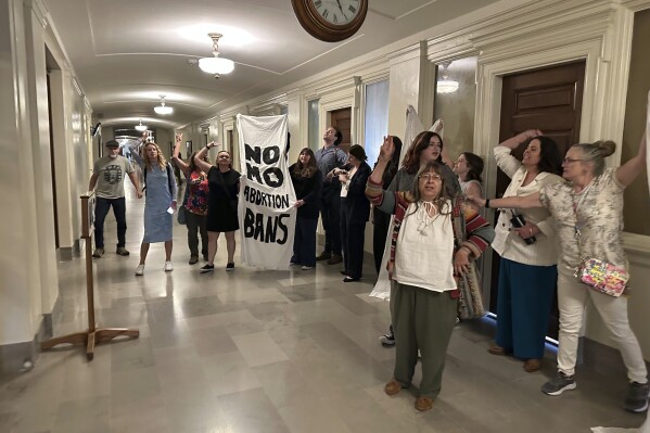 People in support of abortion rights protest outside the Missouri Senate chamber after the Senate voted to approve a referendum seeking to repeal an abortion-rights amendment on Wednesday, May 14, 2025, in Jefferson City, Mo. (AP Photo/David A. Lieb)