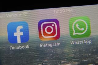 FILE - This photo shows the mobile phone app logos for, from left, Facebook, Instagram and WhatsApp in New York, Oct. 5, 2021. WhatsApp is adding more details to its privacy policy and flagging the information for European users. The update is to comply with a ruling from Irish regulators who slapped the chat service with a record fine for breaching strict EU data privacy rules. Starting Monday, Nov. 22 WhatsApp’s privacy policy will be reorganized to provide more information on the data it collects and how it’s used.  (AP Photo/Richard Drew, file)