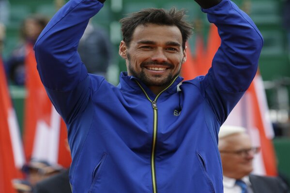 
              Italy's Fabio Fognini poses with a trophy after defeating Serbia's Dusan Lajovic in the men's singles final match of the Monte Carlo Tennis Masters tournament in Monaco, Sunday, April, 21, 2019. (AP Photo/Claude Paris)
            