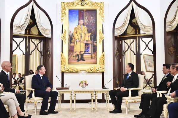 In this photo released by the Government Spokesman Office, Britain's Foreign Secretary, David Cameron, left, talks with Thailand's Prime Minister Srettha Thavisin, at the Government house in Bangkok, Thailand, Wednesday, March 20, 2024. (Thailand's Government Spokesman Office via AP)