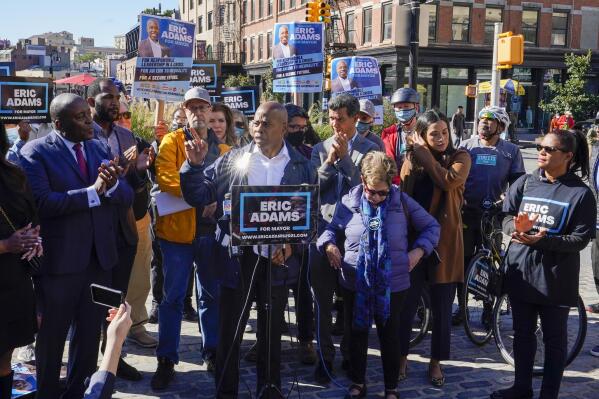 Eric Adams, Democrat candidate for New York Mayor, center, speaks during a campaign event, Tuesday, Oct. 19, 2021, in New York. (AP Photo/Mary Altaffer)