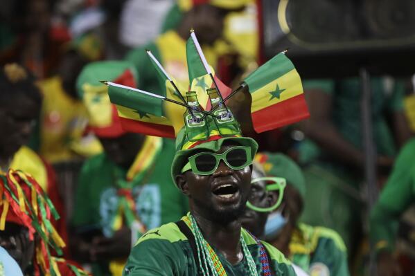 Senegal supporter cheers prior to the start of the African Cup of Nations 2022 semi-final soccer match between Burkina Faso and Senegal at the Ahmadou Ahidjo stadium in Yaounde, Cameroon, Wednesday, Feb. 2, 2022. (AP Photo/Sunday Alamba)