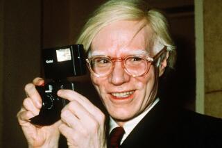FILE - In this 1976 file photo, pop artist Andy Warhol smiles in New York. The Supreme Court on Thursday, May 18, 2023, sided with a photographer who claimed the late Andy Warhol had violated her copyright on a photograph of the singer Prince. The Supreme Court sided 7-2 with photographer Lynn Goldsmith. The case involved images Warhol created of Prince as part of a 1984 commission for Vanity Fair. Warhol used a Goldsmith photograph as his starting point. (AP Photo/Richard Drew, File)