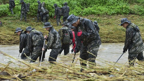 South Korean marines search for those missing from floodwaters in Yecheon, South Korea, on July 18, 2023. (Lee Moo-ryul/Newsis via AP)