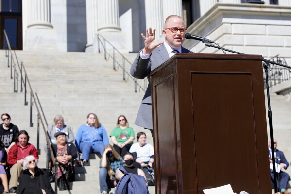 Chase Glenn, executive director of Alliance for Full Acceptance, speaks at a rally against a South Carolina bill banning gender-affirming care for minors, Wednesday, Feb. 14, 2024, in Columbia, S.C. LGBTQ+ advocates like Glenn say that Republican presidential candidates' rhetoric around transgender-related issues is jeopardizing the safety of an already vulnerable community. (AP Photo/Jeffrey Collins)