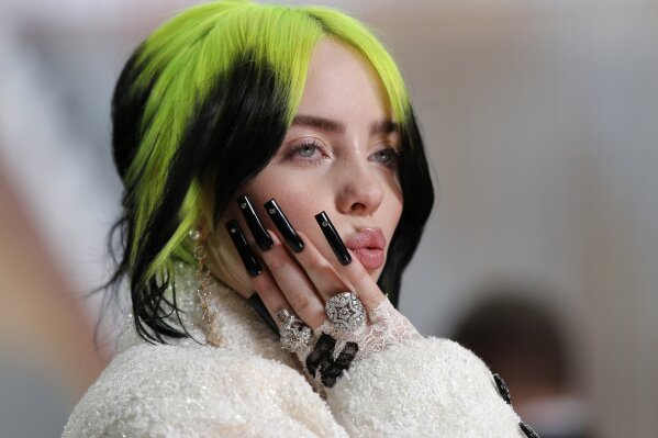FILE - In this Feb. 9, 2020, file photo, singer Billie Eilish arrives at the Oscars in Los Angeles. Billie Eilish scored 12, 2020 Billboard Music Awards nominations, dick clark productions and NBC ...