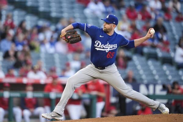 Los Angeles Dodgers starting pitcher James Paxton throws to a Los Angeles Angels batter during the first inning of an exhibition baseball game Tuesday, March 26, 2024, in Anaheim, Calif. (AP Photo/Ryan Sun)