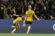Australia's Hayley Raso, left, celebrates her side's second goal during the Women's World Cup round of 16 soccer match between Australia and Denmark at Stadium Australia in Sydney, Australia, Monday, Aug. 7, 2023. (AP Photo/Mark Baker)