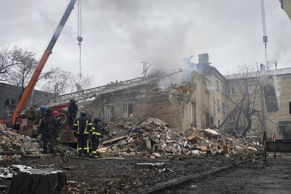 In this photo provided by the Ihor Moroz, Head of the Donetsk Regional Military Administration, rescuers work at the scene of a building damaged by shelling, in Novogrodivka, Ukraine, Thursday, Nov. 30, 2023. (Ihor Moroz, Head of the Donetsk Regional Military Administration via AP)