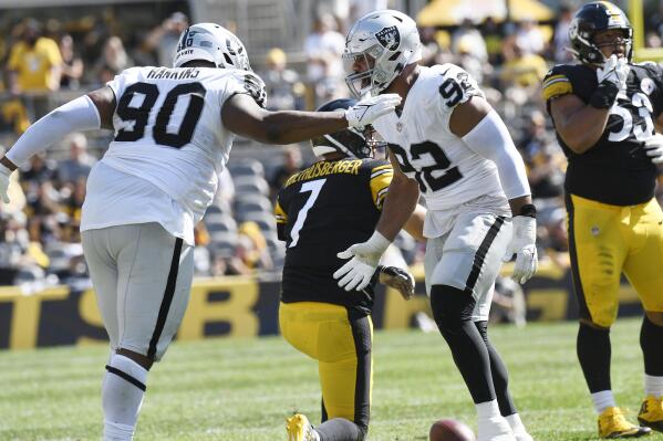 Las Vegas Raiders defensive end Solomon Thomas (92) and defensive tackle Johnathan Hankins (90) celebrate sacking Pittsburgh Steelers quarterback Ben Roethlisberger (7) during the second half of an NFL football game in Pittsburgh, Sunday, Sept. 19, 2021. (AP Photo/Don Wright)