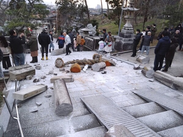 A torii gate is damaged after an earthquake at a shrine in Kanazawa, Ishikawa prefecture, Japan Monday, Jan. 1, 2024. Japan issued tsunami alerts Monday after a series of strong quakes in the Sea of Japan. (Kyodo News via AP)