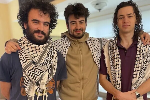 FILE - In this Nov. 23, 2023, photo provided by family attorney Abed Ayoub, three college students, from the left, Tahseen Ali Ahmad, Kinnan Abdalhamid, and Hisham Awartani, stand together for a photograph. More than $950,000 has been raised for the recovery of Awartani, one of the three college students of Palestinian descent who was shot in Vermont and is currently paralyzed from the chest down, according to a GoFundMe page set up by his family. (Rich Price via AP, File)