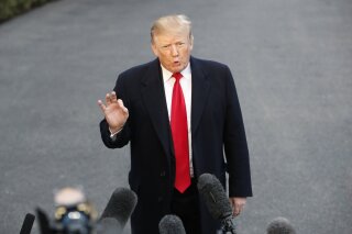President Donald Trump speaks with the media after stepping off Marine One on the South Lawn of the White House, Sunday, March 24, 2019, in Washington. The Justice Department said Sunday that special counsel Robert Mueller's investigation did not find evidence that President Donald Trump's campaign "conspired or coordinated" with Russia to influence the 2016 presidential election. (AP Photo/Pablo Martinez Monsivais)