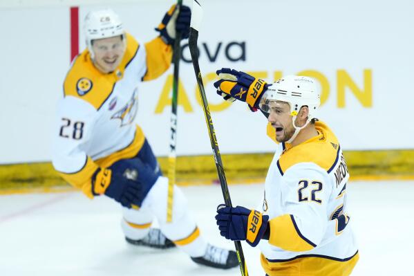 Nashville's Nino Niederreiter, right, celebrates with Nashville's Eeli Tolvanen after scoring his sides second goal during the NHL hockey game between San Jose Sharks and Nashville Predators played in Prague, Czech Republic, Saturdday, Oct. 8, 2022. (AP Photo/Petr David Josek)