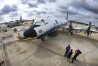 One of the National Oceanic and Atmospheric Administration's (NOAA) WP-3D Orion aircraft sits on the tarmac, with the U.S. Air Force Reserve 53rd Weather Reconnaissance Squadron's WC-130J, far left, during a stop at Orlando Sanford International Airport, in Sanford, Fla., Friday, May 10, 2024. The planes are "Hurricane Hunters" — flying science labs that navigates into the heart of tropical cyclones— collecting real-time storm data. (Joe Burbank /Orlando Sentinel via AP)