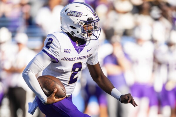 James Madison quarterback Jordan McCloud scrambles in the first half of an NCAA college football game against Georgia State, Saturday, Nov. 4 2023, in Atlanta. (AP Photo/Hakim Wright Sr.)