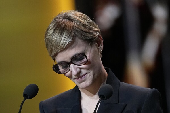 French actress Judith Godreche speaks during the 49th Cesar Award ceremony in Paris, Friday, Feb. 23, 2024. French actress Judith Godreche has called on France's film industry to "face the truth" on sexual violence and physical abuse during a live broadcast Friday of the Cesar Awards ceremony, France's version of the Oscars. (AP Photo/Michel Euler)