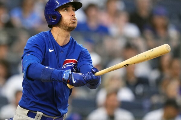 FILE - Chicago Cubs' Cody Bellinger watches his home run during the third inning of a baseball game against the New York Yankees, July 7, 2023, in New York. There are still some premium free agents available for Major League Baseball teams as the calendar nears March. Two-time Cy Young Winner Blake Snell, six-time All-Star J.D. Martinez and former MVP Cody Bellinger are among the players who haven't found a home. (APPhoto/Frank Franklin II, File)