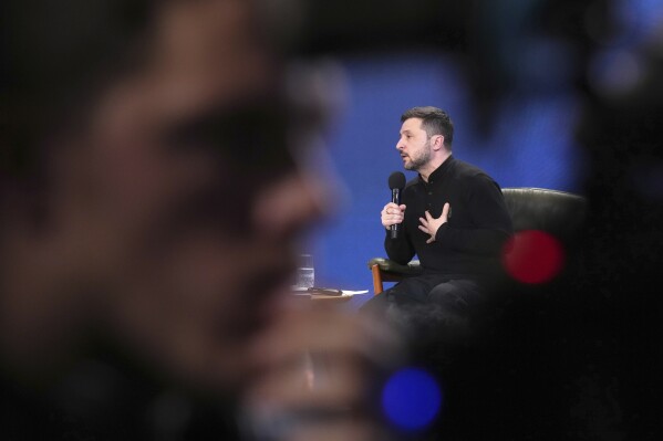 Ukrainian President Volodymyr Zelenskyy answers media questions during his press conference, in Kyiv, Ukraine, Sunday, Feb. 23, 2025. (AP Photo/Evgeniy Maloletka)